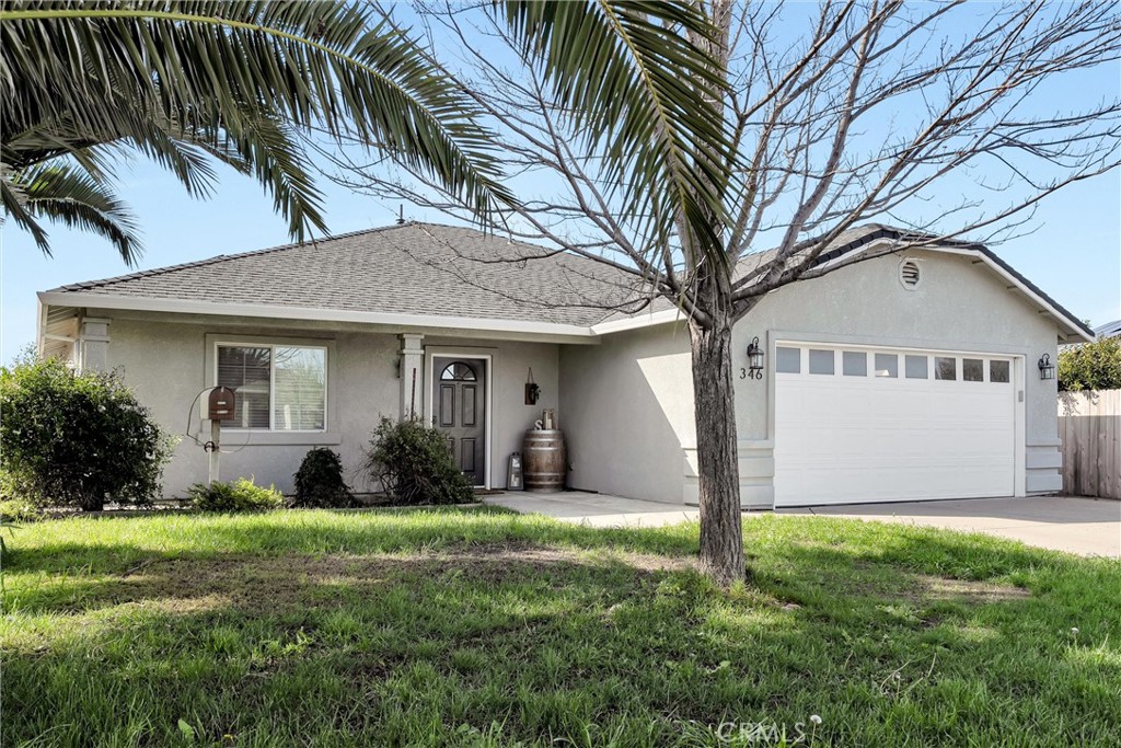 346 Stanton Way Orland, CA 95963 - Photo 30 of 41 a view of a white house with a big yard and potted plants