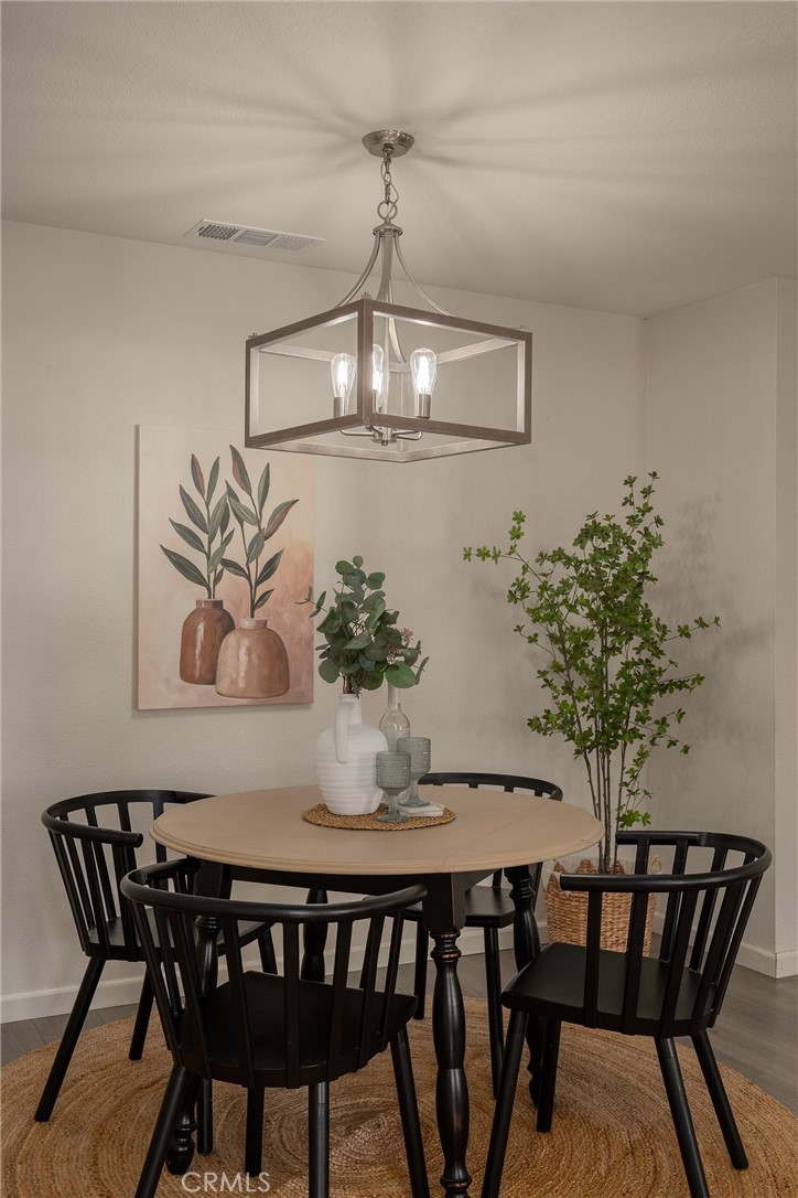 346 Stanton Way Orland, CA 95963 - Photo 8 of 41 a dining room with furniture and wooden floor