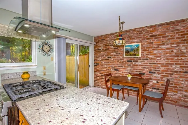 a living room with a table and chairs