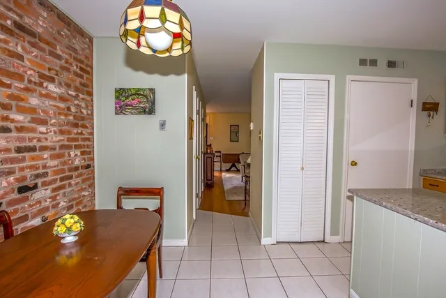a view of kitchen with furniture and wooden floor