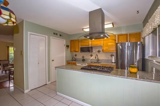 a bathroom with a sink a mirror and a shower