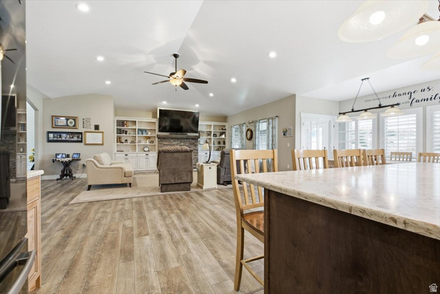 3123 East Riverdale Road Preston, ID 83263 - Photo 10 of 52 Spacious open-concept living area featuring wood-finish flooring, vaulted ceilings, and recessed lighting