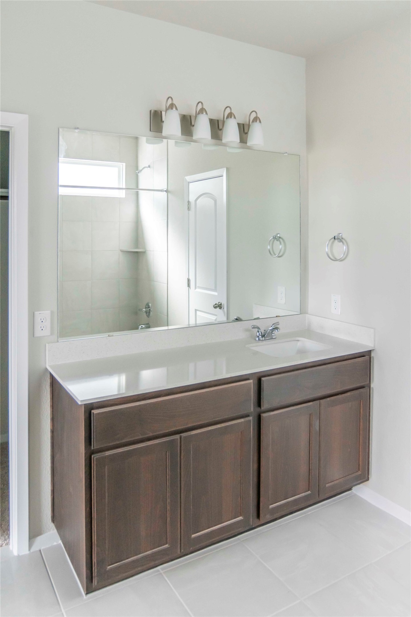 1257 Goforth Road Kyle, TX 78640 - Photo 12 of 33 Full bath featuring light tile patterned floors and double vanity