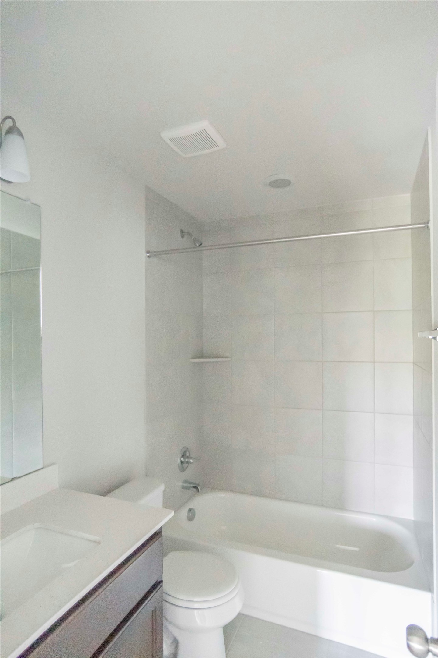 1257 Goforth Road Kyle, TX 78640 - Photo 15 of 33 Bathroom featuring vanity, washtub / shower combination, and light tile patterned floors
