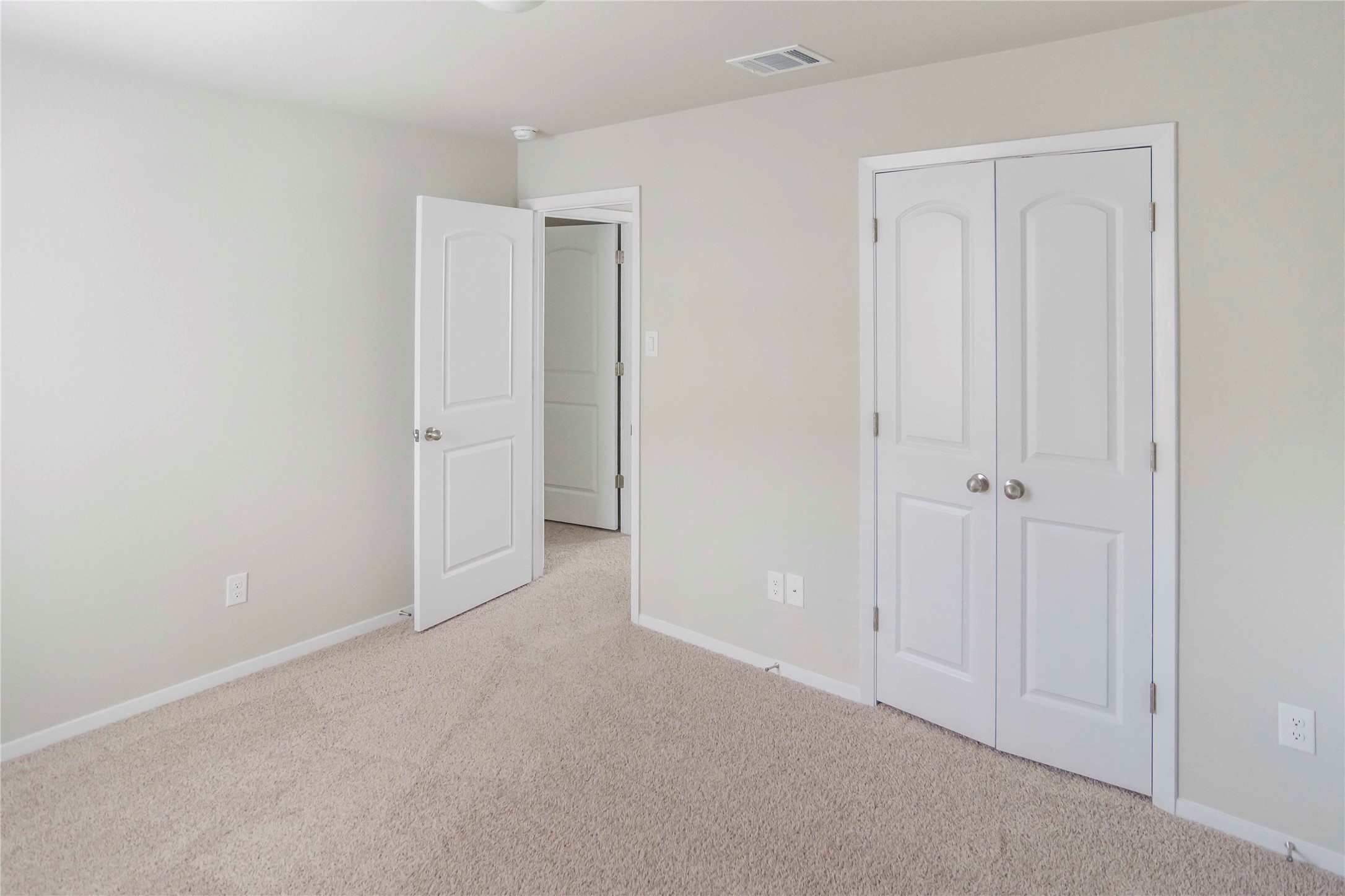 1257 Goforth Road Kyle, TX 78640 - Photo 16 of 33 Unfurnished bedroom with light carpet and a closet