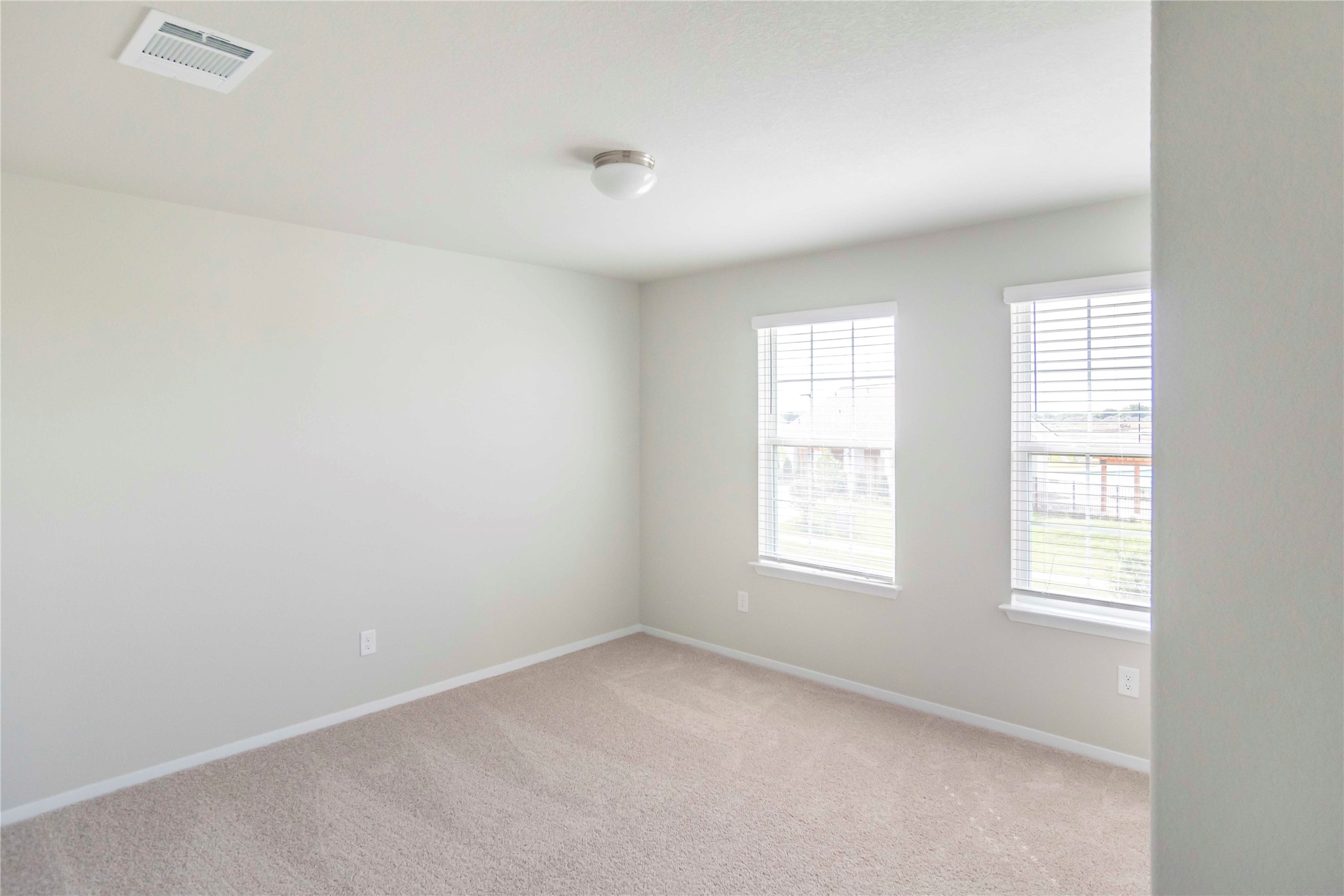 1257 Goforth Road Kyle, TX 78640 - Photo 18 of 33 Unfurnished room featuring light colored carpet and baseboards