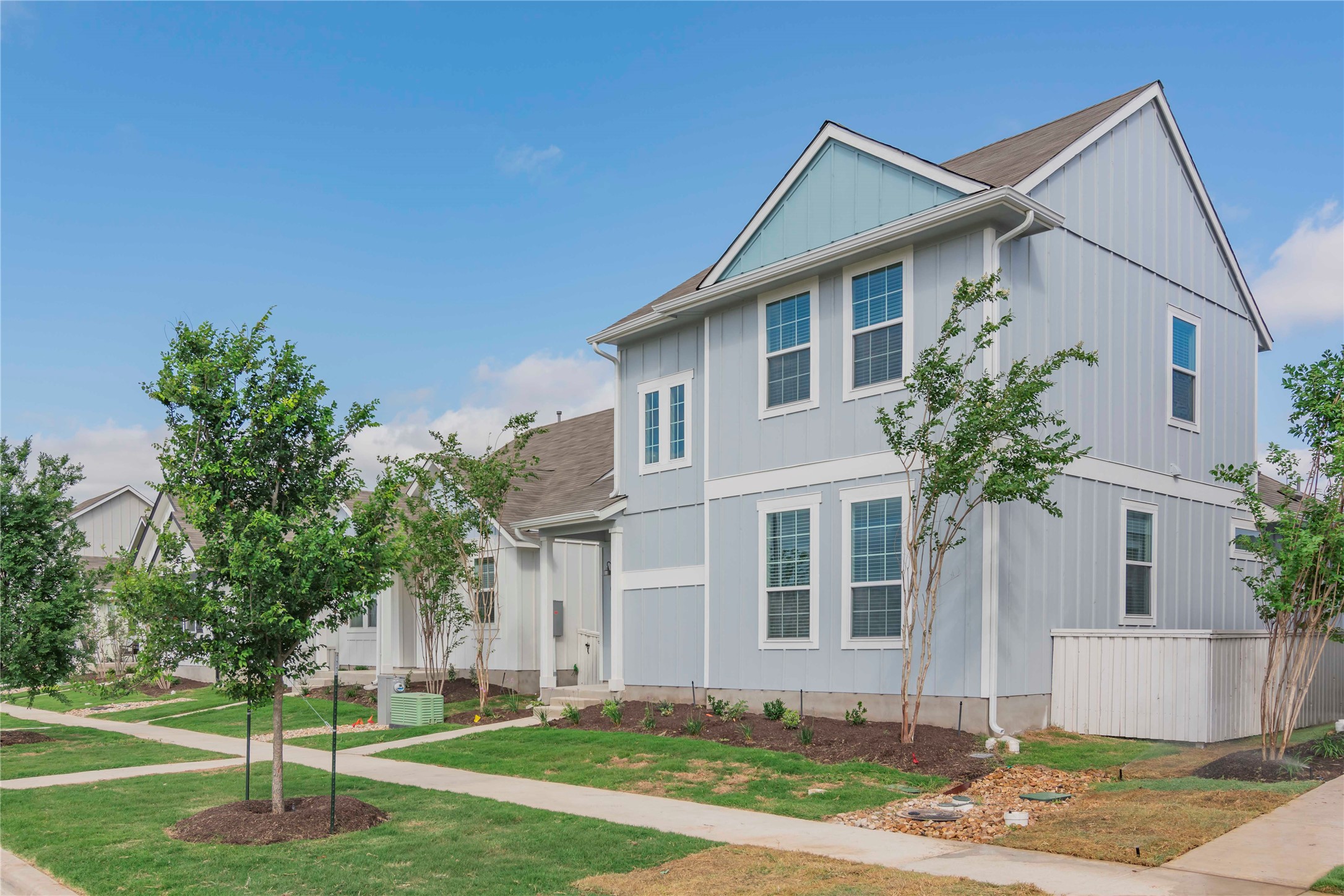 1257 Goforth Road Kyle, TX 78640 - Photo 2 of 33 View of front of home featuring a front yard and board and batten siding