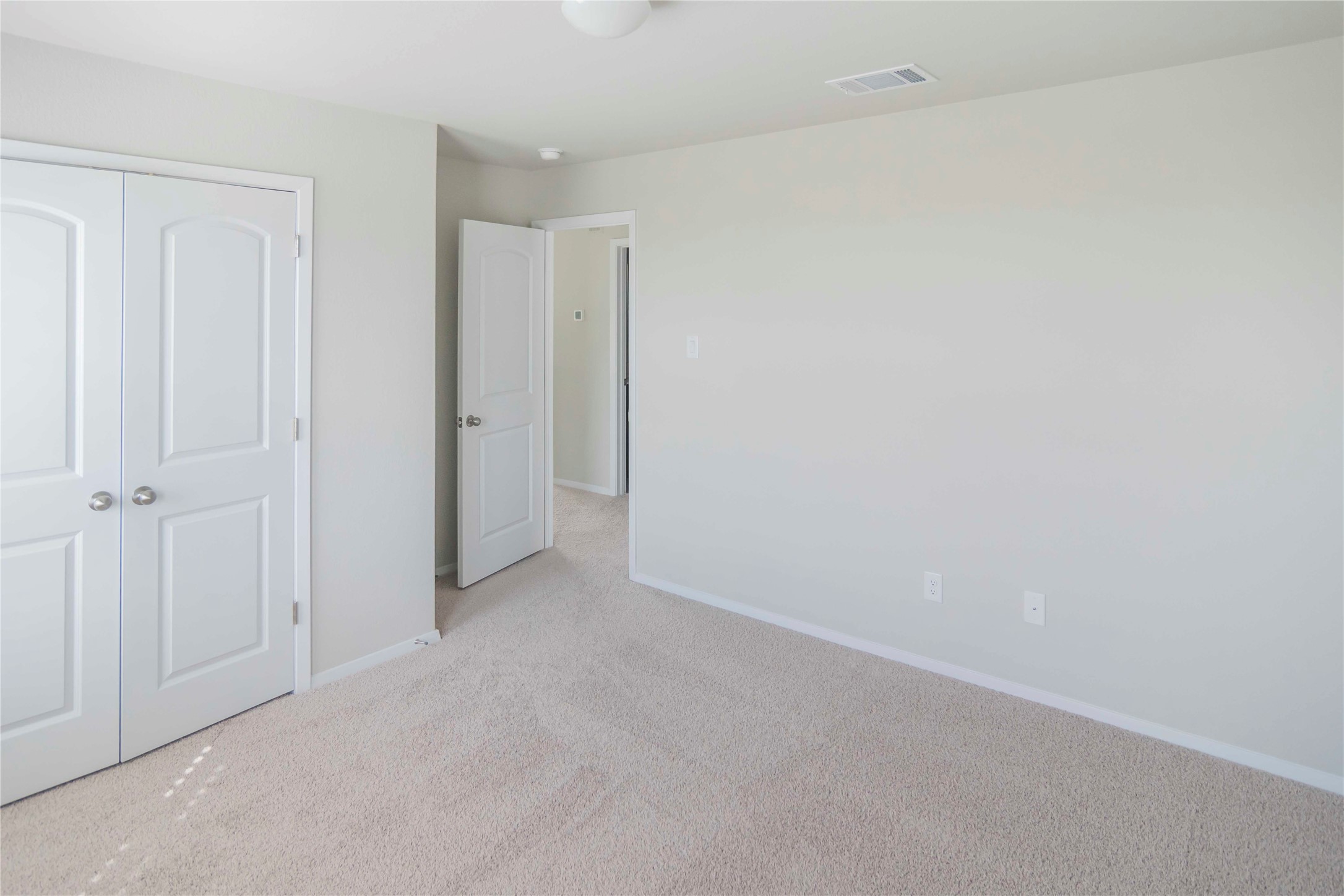 1257 Goforth Road Kyle, TX 78640 - Photo 19 of 33 Unfurnished bedroom with carpet flooring and a closet