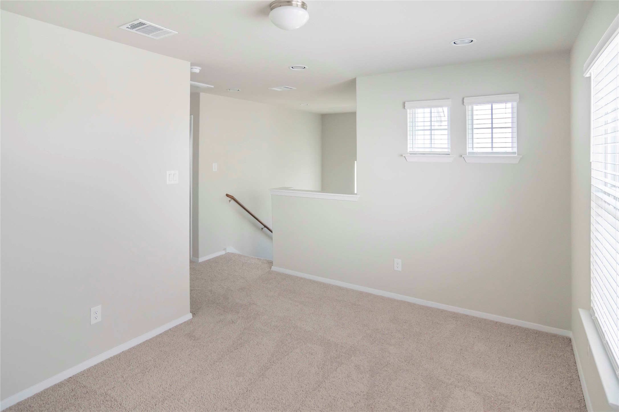 1257 Goforth Road Kyle, TX 78640 - Photo 21 of 33 Spare room featuring light colored carpet and baseboards