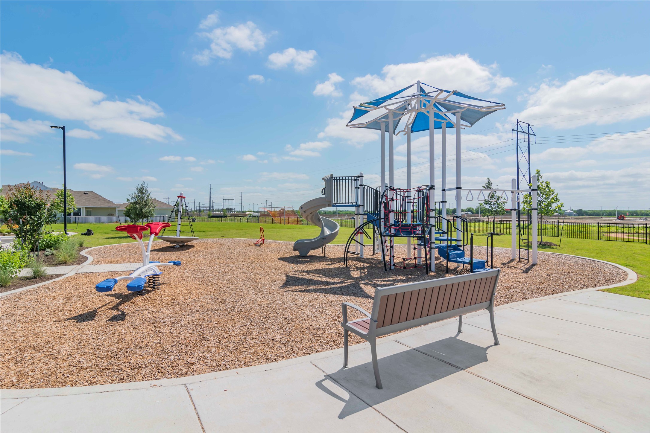 1257 Goforth Road Kyle, TX 78640 - Photo 25 of 33 Community playground featuring a lawn