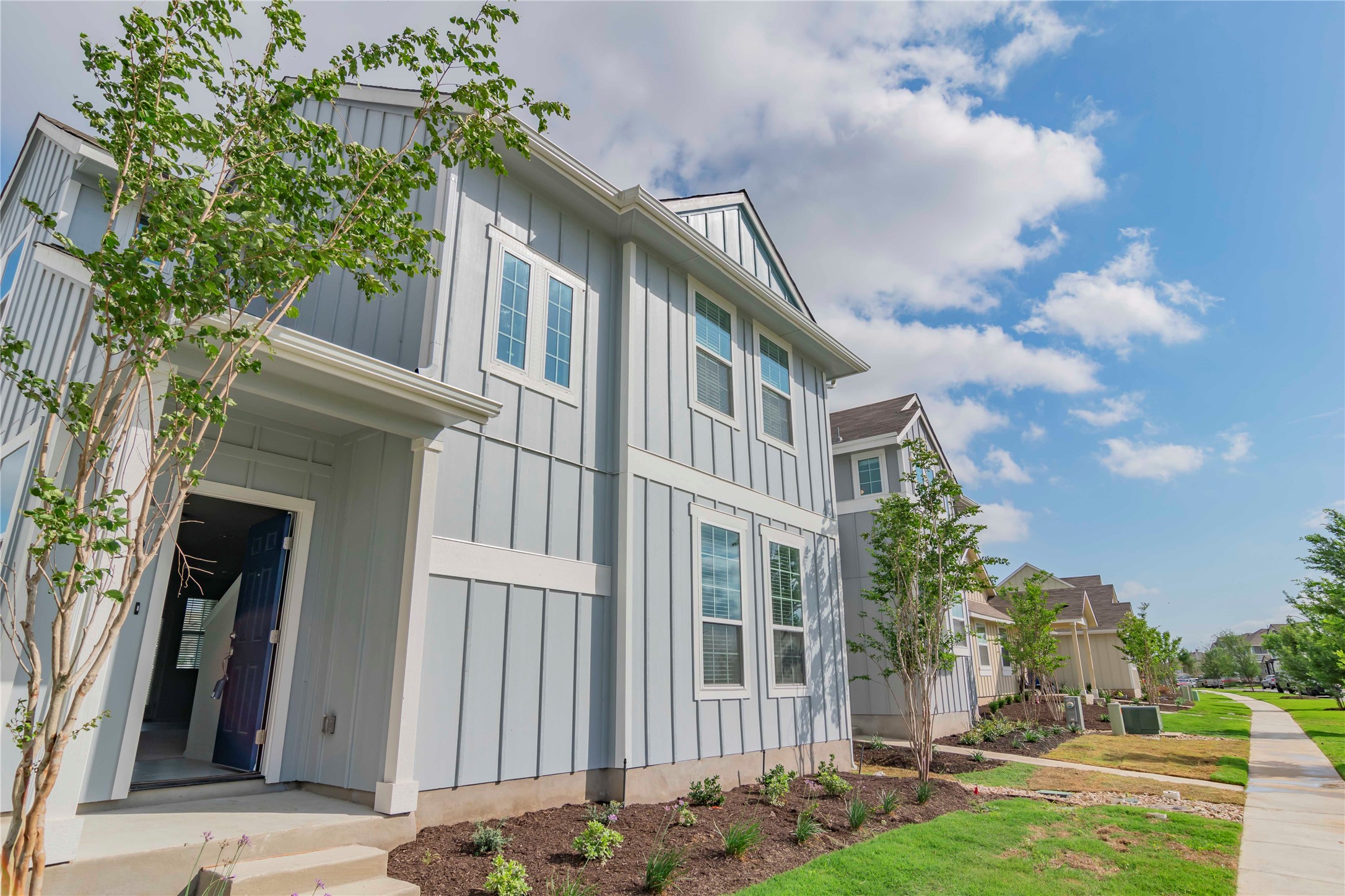 1257 Goforth Road Kyle, TX 78640 - Photo 3 of 33 View of side of property with board and batten siding