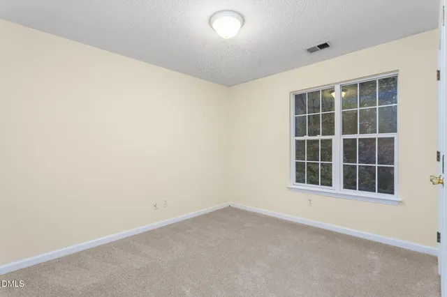 an empty room with closet area