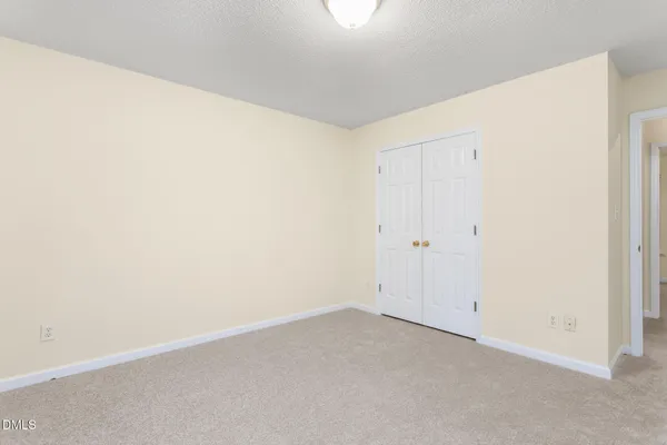 an empty room with a bathroom