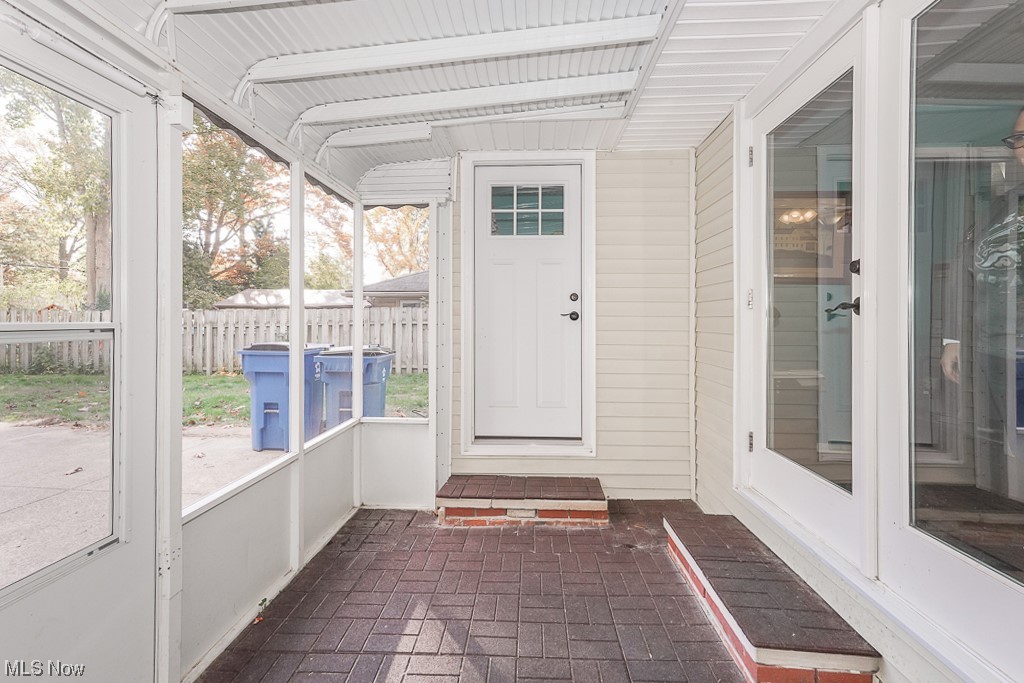 1127 Garden Road Willoughby, OH 44094 - Photo 26 of 33 Unfurnished sunroom featuring vaulted ceiling