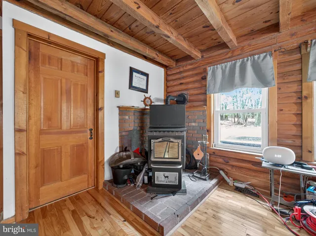 a living room with furniture a window and a fireplace