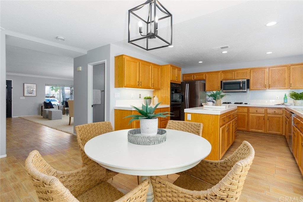 8 Elizabeth Lane Irvine, CA 92602 - Photo 11 of 41 a dining room with dining table a sink a dining table and chairs