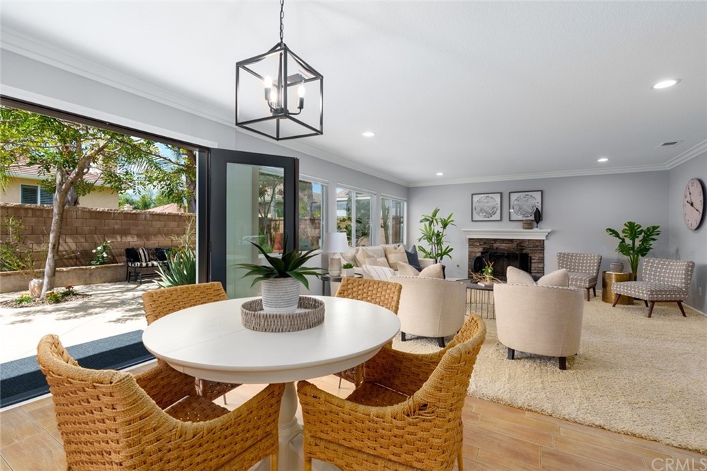 8 Elizabeth Lane Irvine, CA 92602 - Photo 12 of 41 a view of a dining room with furniture wooden floor and a chandelier