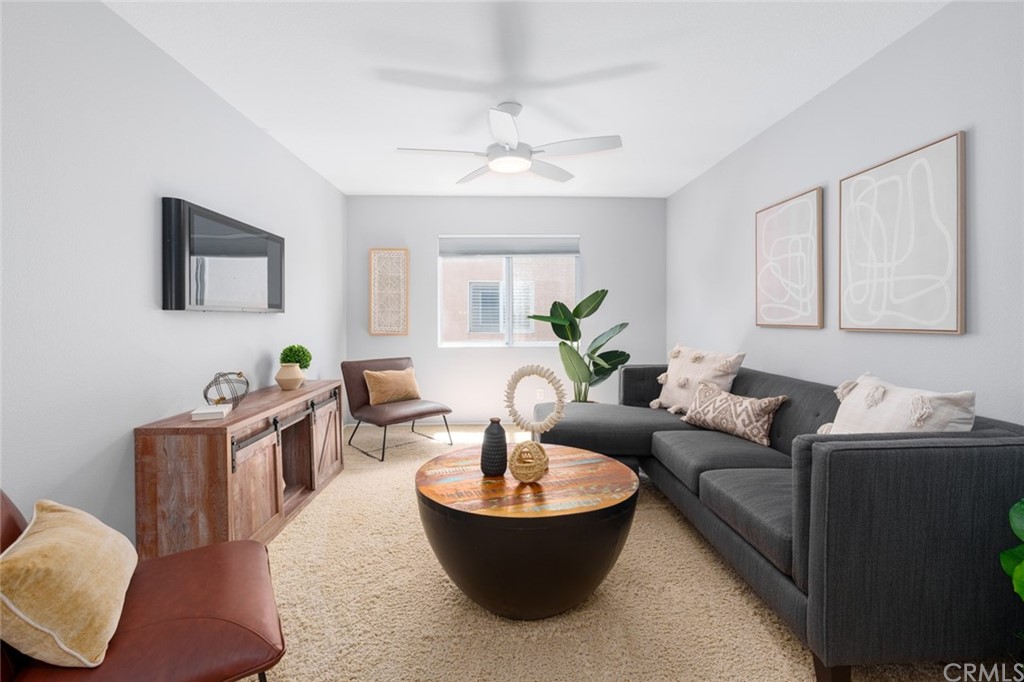 8 Elizabeth Lane Irvine, CA 92602 - Photo 16 of 41 a living room with furniture and a potted plant