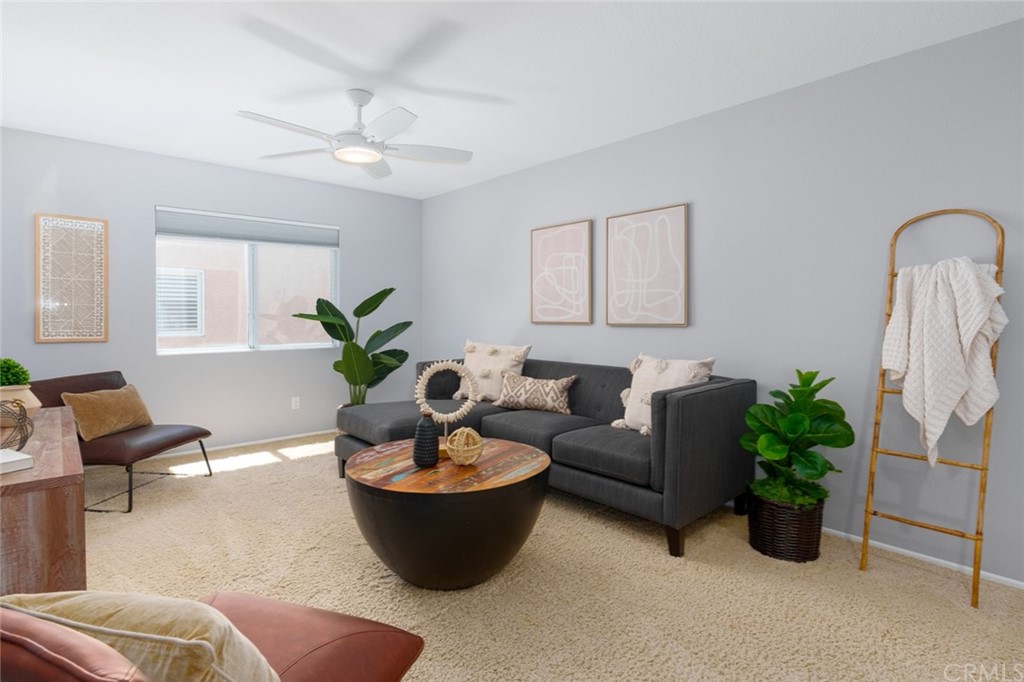 8 Elizabeth Lane Irvine, CA 92602 - Photo 17 of 41 a living room with furniture potted plant and a window