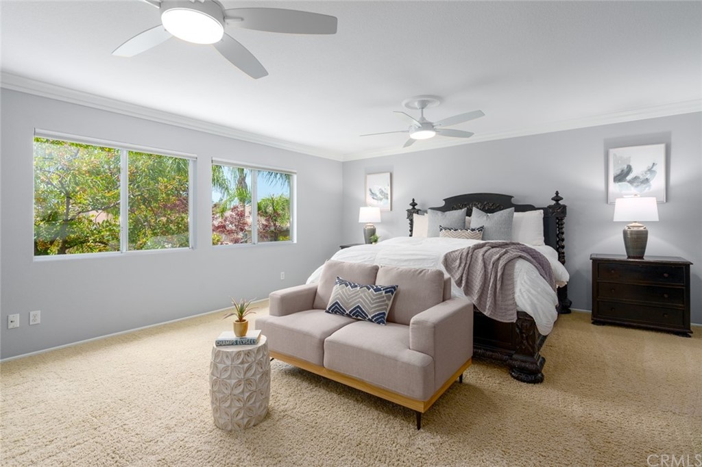 8 Elizabeth Lane Irvine, CA 92602 - Photo 19 of 41 a bedroom with a bed couches and window