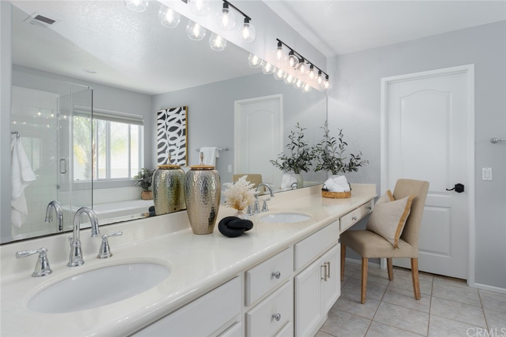 8 Elizabeth Lane Irvine, CA 92602 - Photo 22 of 41 a bathroom with a double vanity sink and a mirror