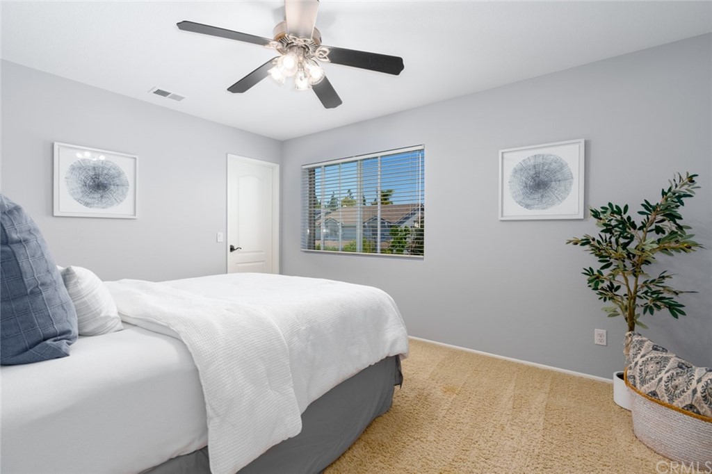 8 Elizabeth Lane Irvine, CA 92602 - Photo 25 of 41 a bedroom with a large bed and a window