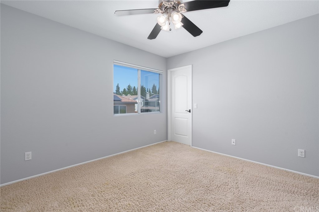 8 Elizabeth Lane Irvine, CA 92602 - Photo 28 of 41 an empty room with windows and fan
