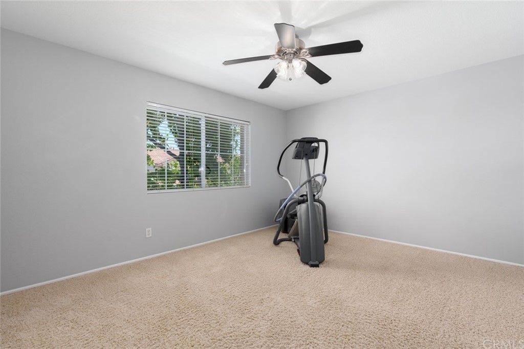 8 Elizabeth Lane Irvine, CA 92602 - Photo 29 of 41 an empty room with a window and ceiling fan