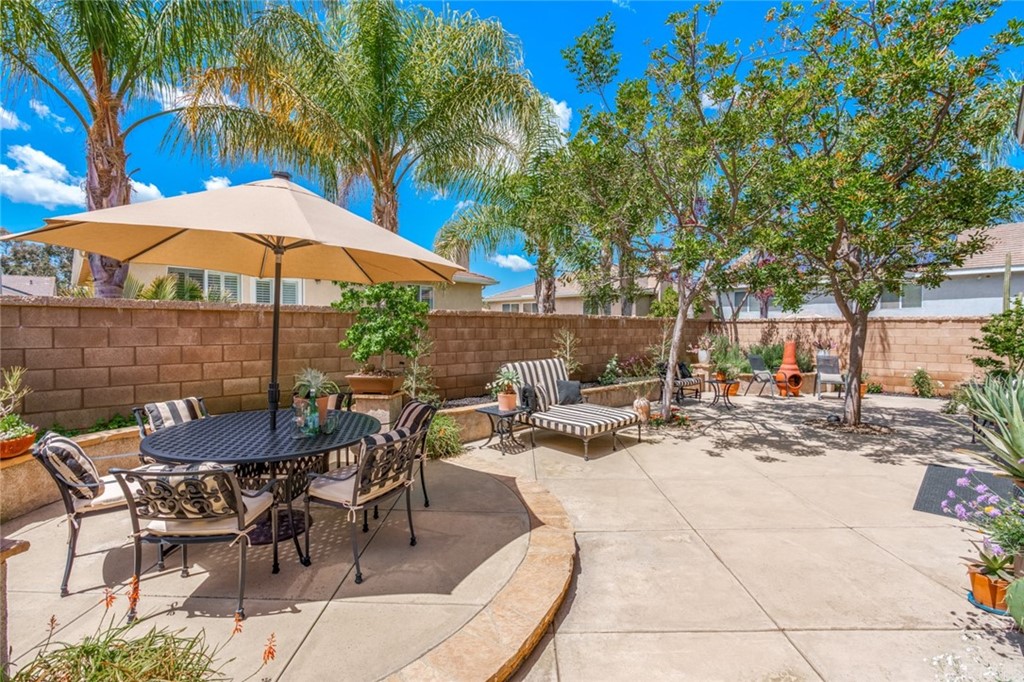 8 Elizabeth Lane Irvine, CA 92602 - Photo 31 of 41 a view of backyard with outdoor seating and trees