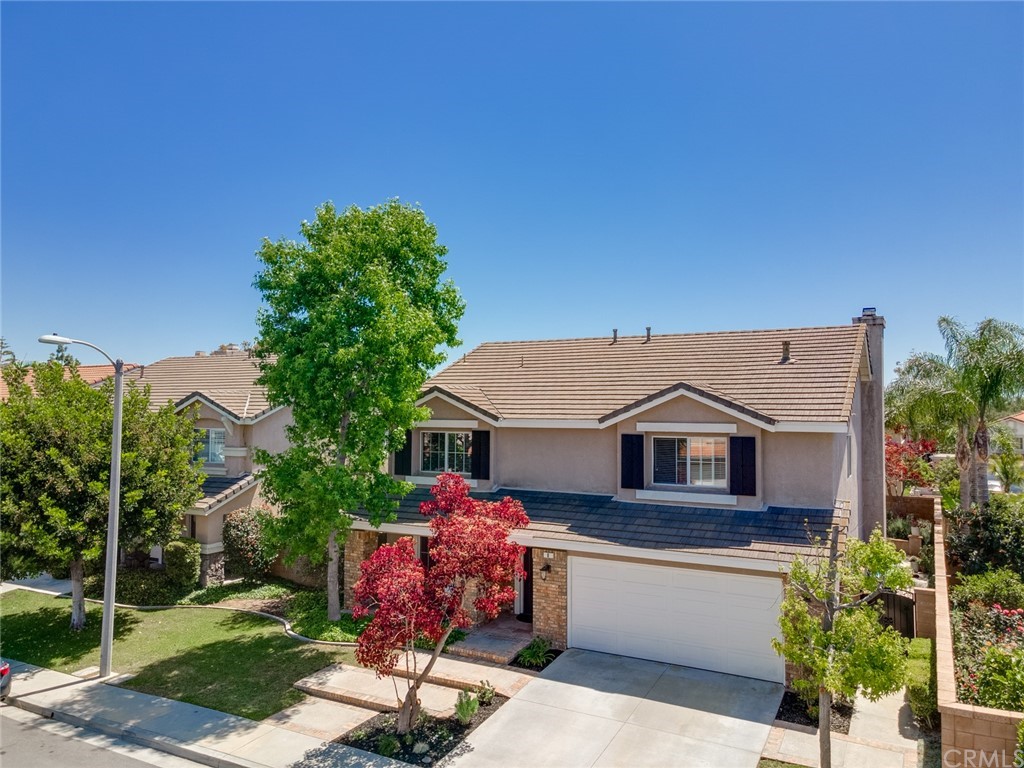8 Elizabeth Lane Irvine, CA 92602 - Photo 37 of 41 a front view of a house with a garden