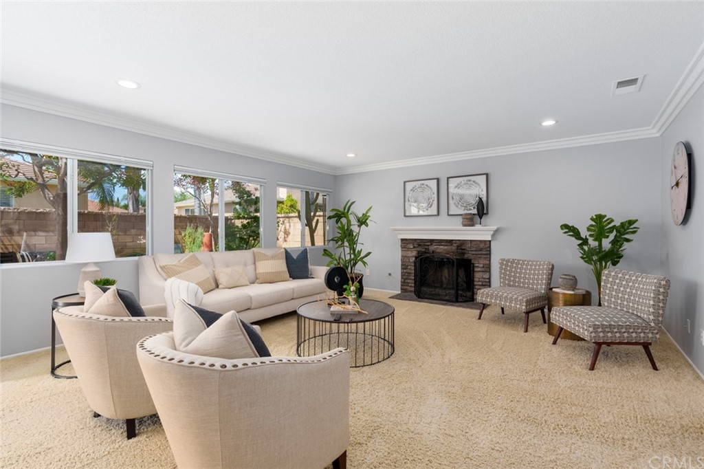 8 Elizabeth Lane Irvine, CA 92602 - Photo 7 of 41 a living room with furniture and a fireplace