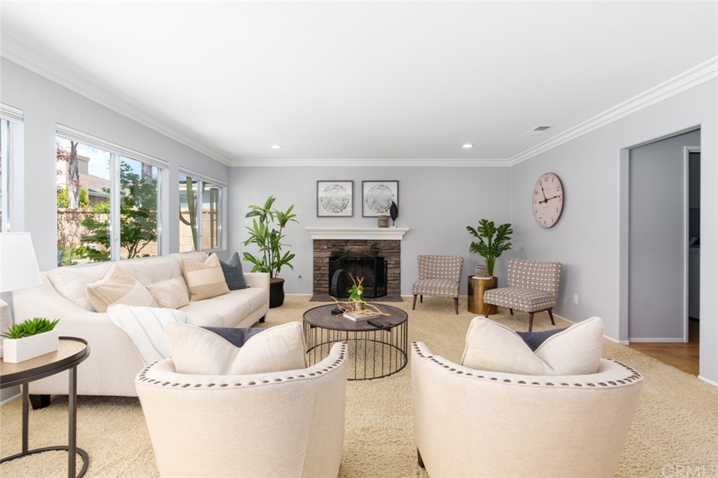 8 Elizabeth Lane Irvine, CA 92602 - Photo 8 of 41 a living room with furniture and a fireplace