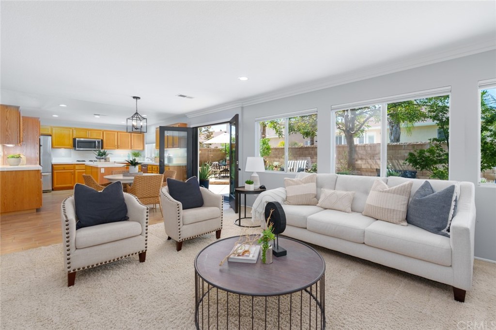 8 Elizabeth Lane Irvine, CA 92602 - Photo 9 of 41 a living room with furniture and a large window