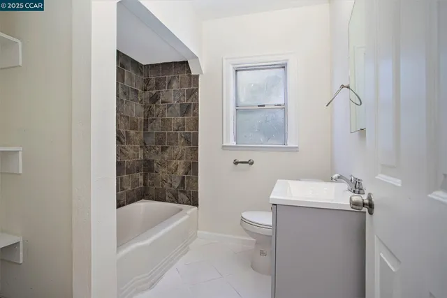 a bathroom with a bathtub a toilet and a shower