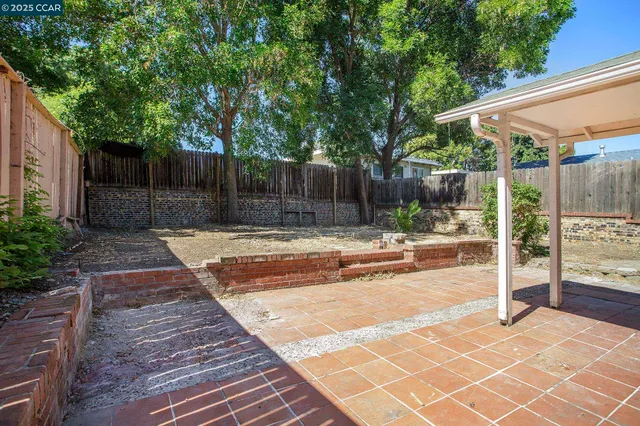 a swimming pool with wooden fence