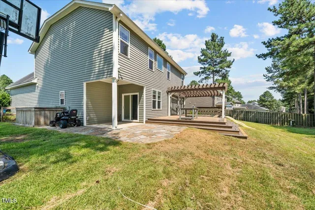 a view of a backyard with a bird bath