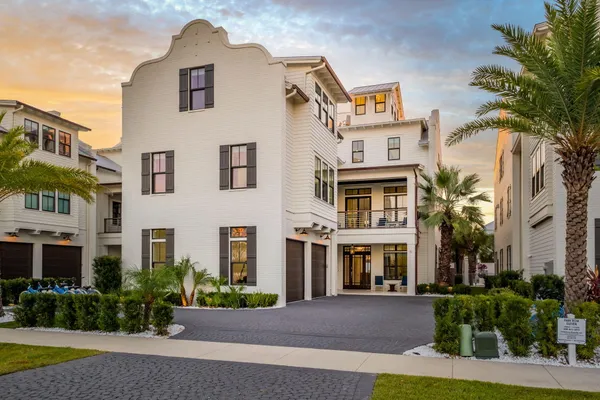 a front view of a residential apartment building with a yard