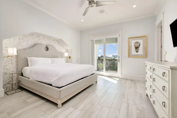 a large white bed in a white room