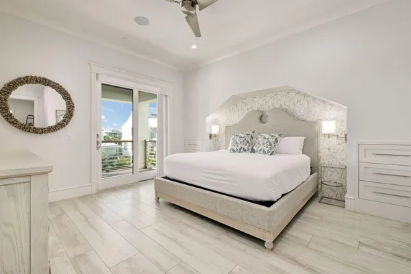 a spacious bedroom with a bed and a couch