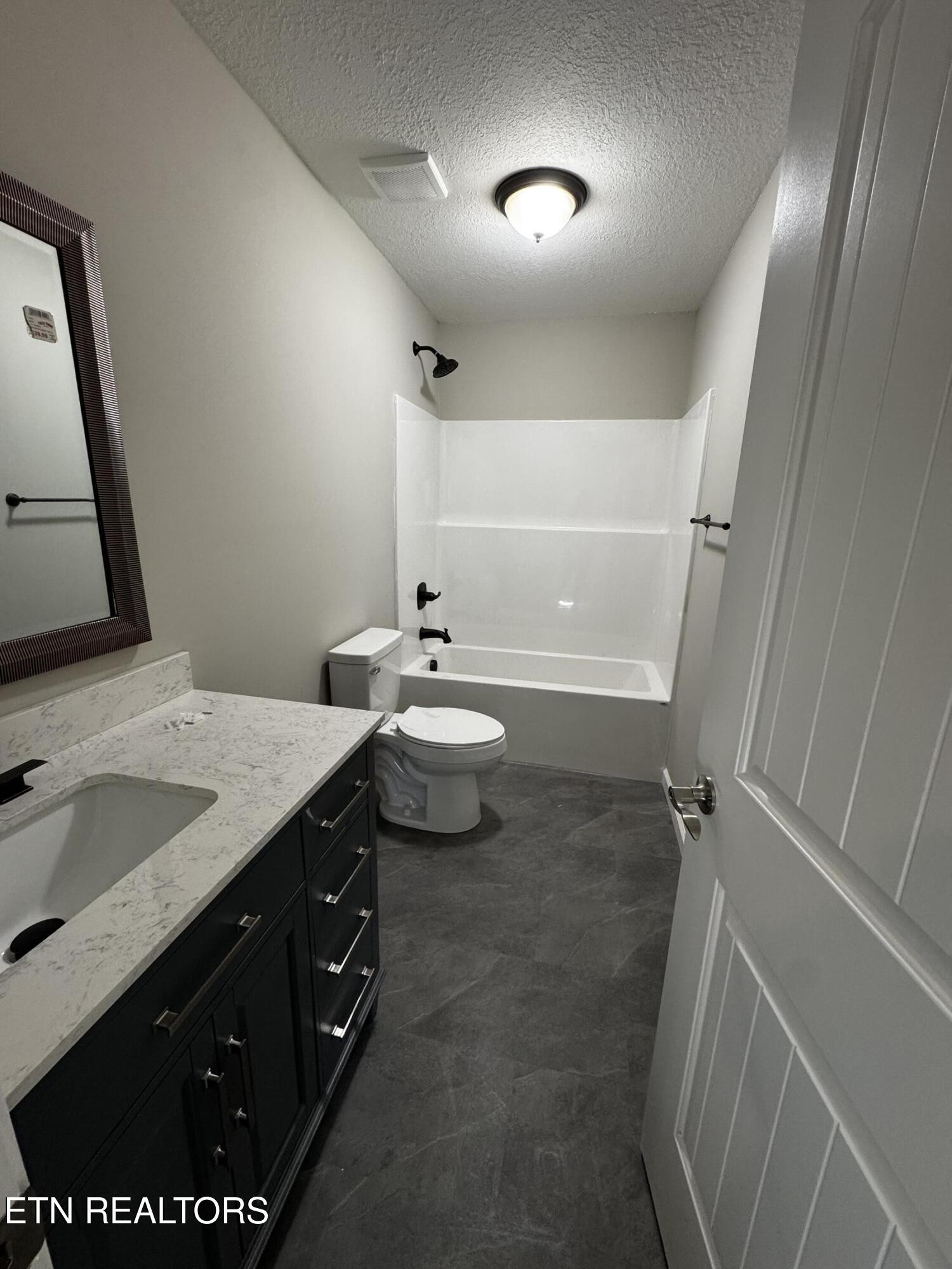129 East Wadsworth Circle Oak Ridge, TN 37830 - Photo 6 of 13 a bathroom with a sink a toilet and mirror