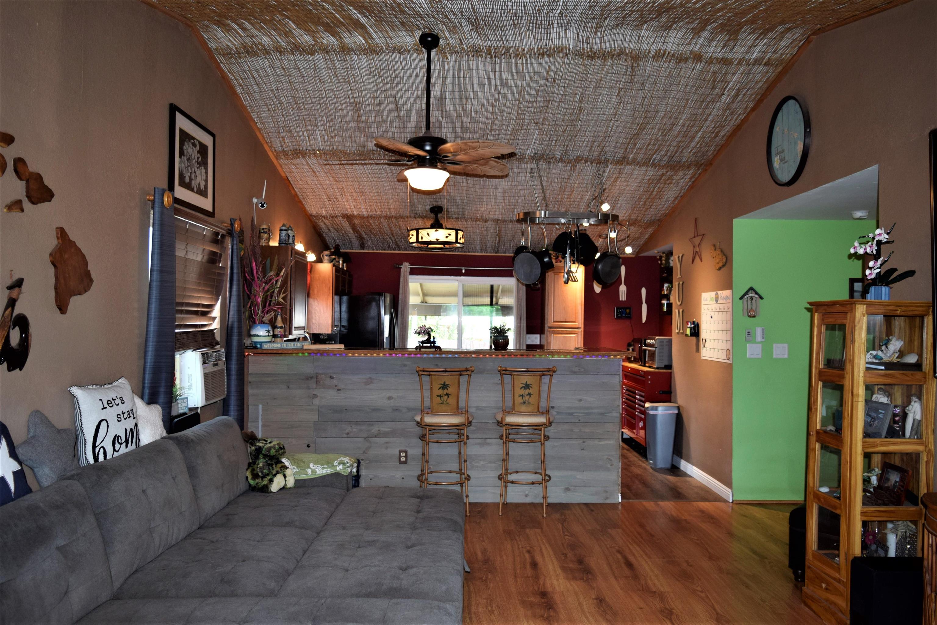 225 Humupea Street Kihei, HI 96753 - Photo 13 of 28 a view of a livingroom with furniture and a flat screen tv