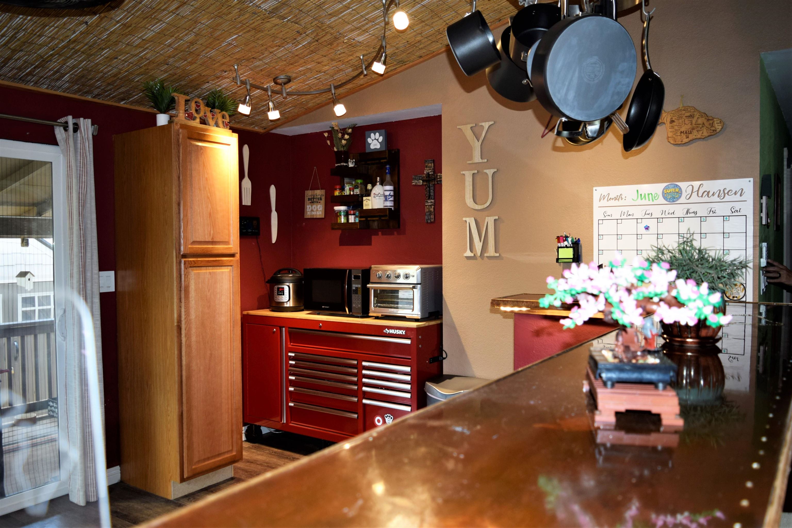 225 Humupea Street Kihei, HI 96753 - Photo 15 of 28 a dining room filled with furniture and a chandelier