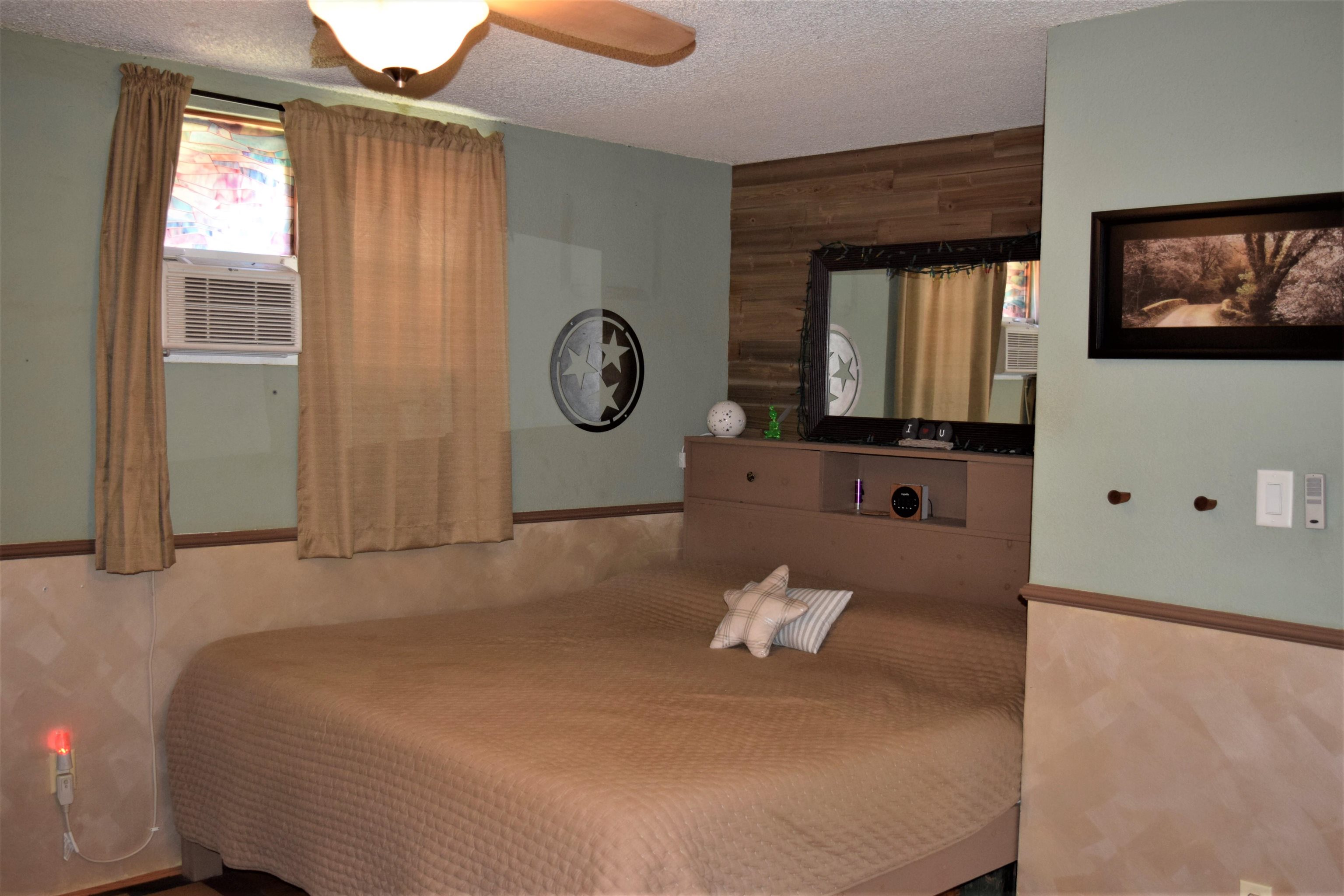 225 Humupea Street Kihei, HI 96753 - Photo 21 of 28 a bed room with a bed mirror and a window