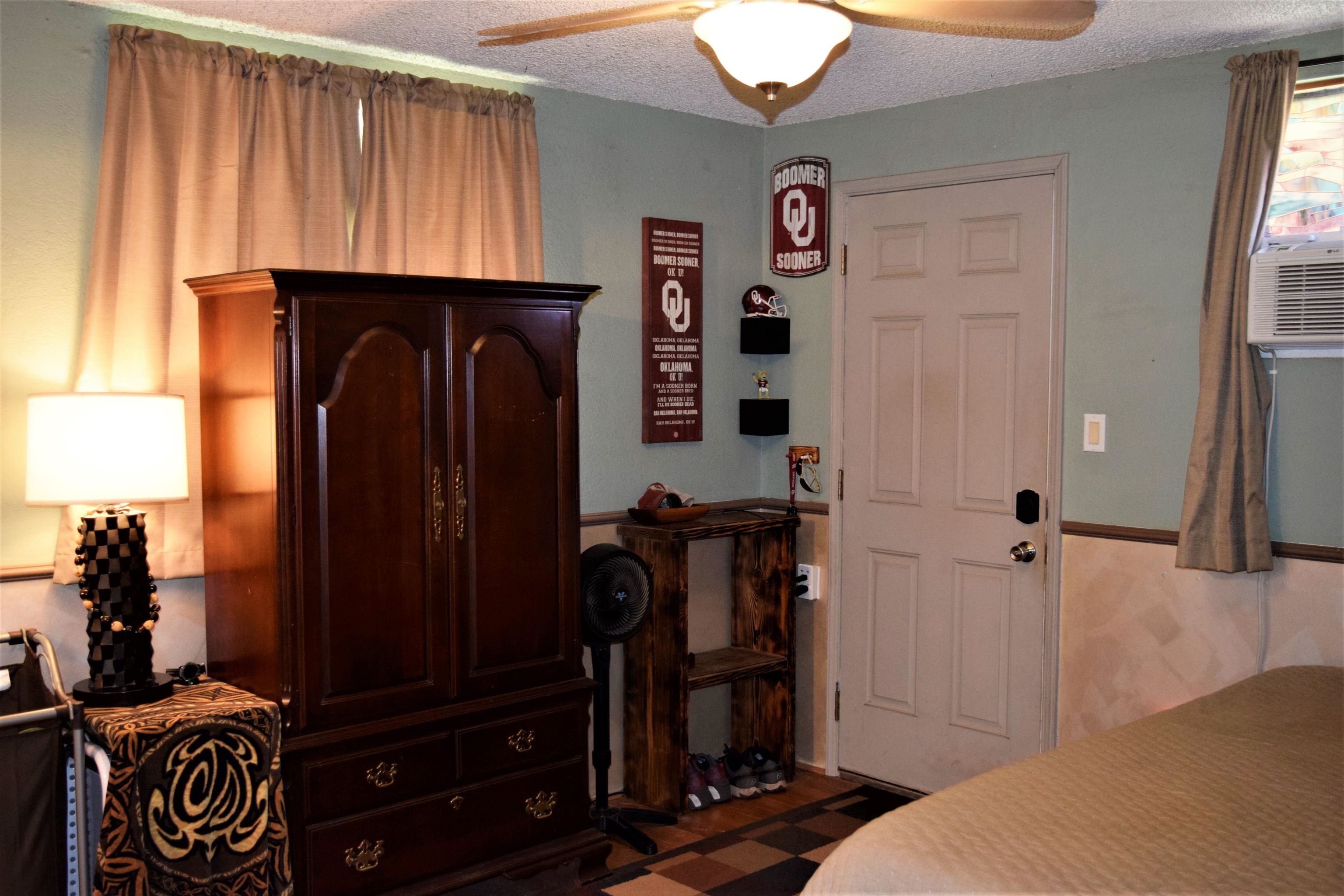 225 Humupea Street Kihei, HI 96753 - Photo 22 of 28 a bedroom with a bed and a closet