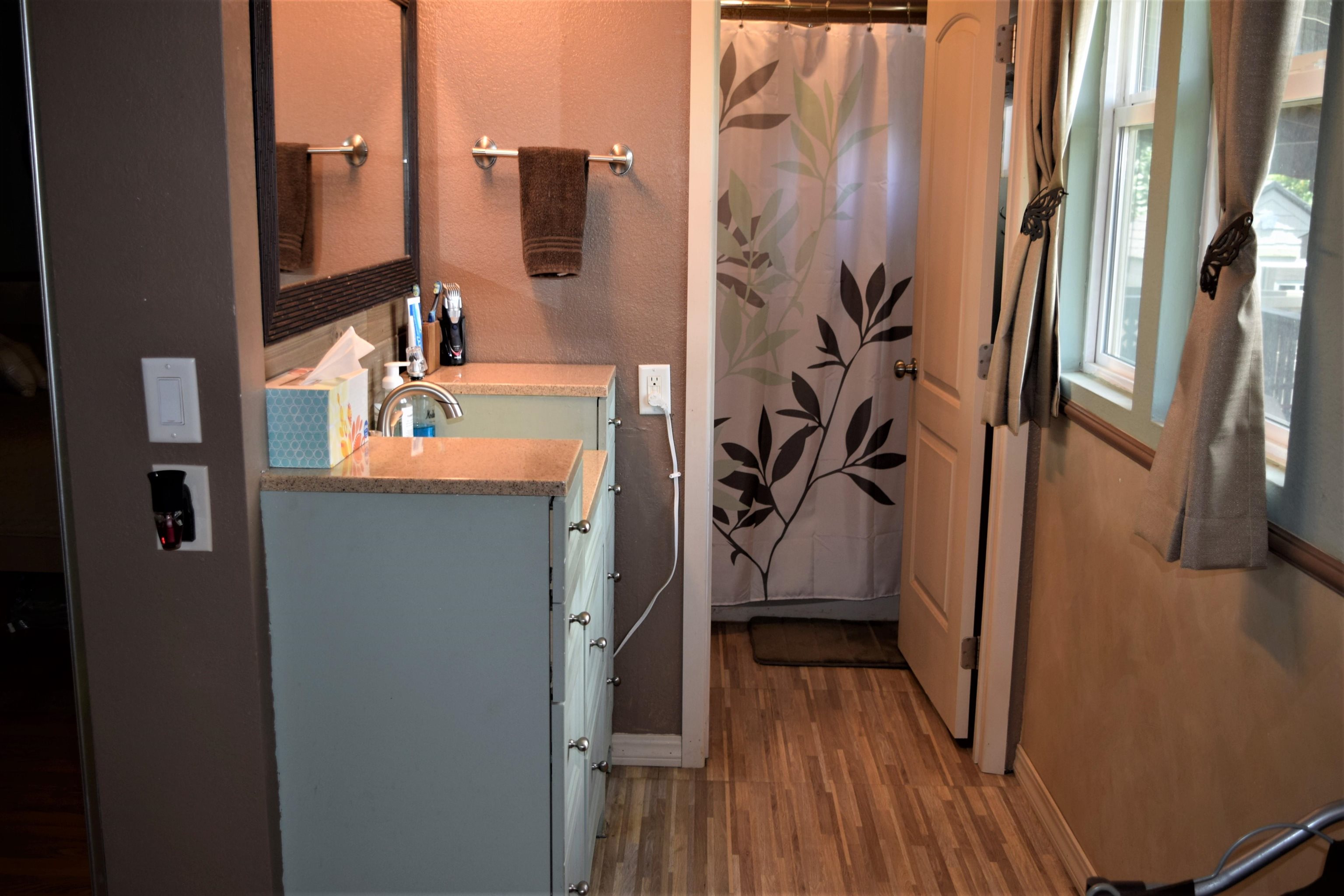 225 Humupea Street Kihei, HI 96753 - Photo 23 of 28 a bathroom with a sink and mirror