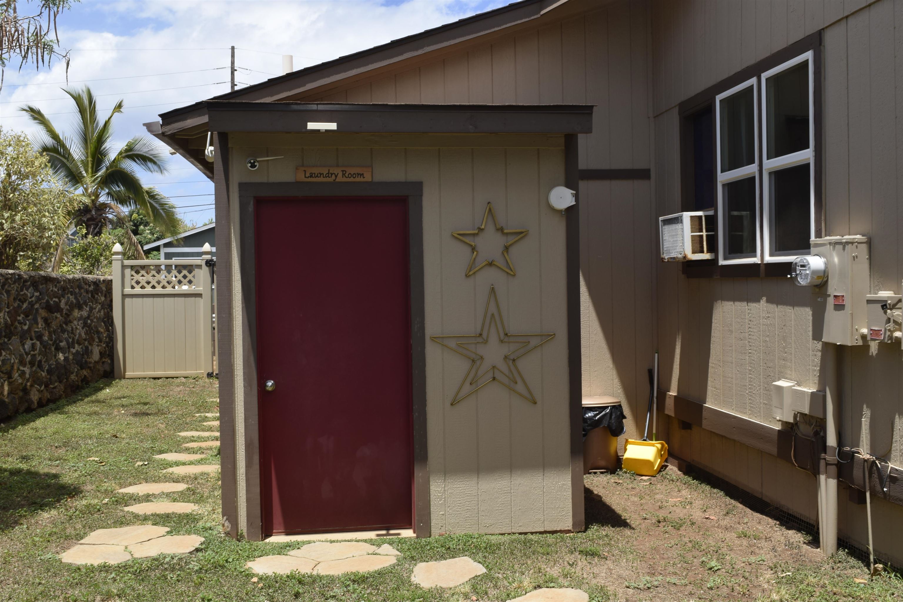 225 Humupea Street Kihei, HI 96753 - Photo 6 of 28 a front view of a house with a yard