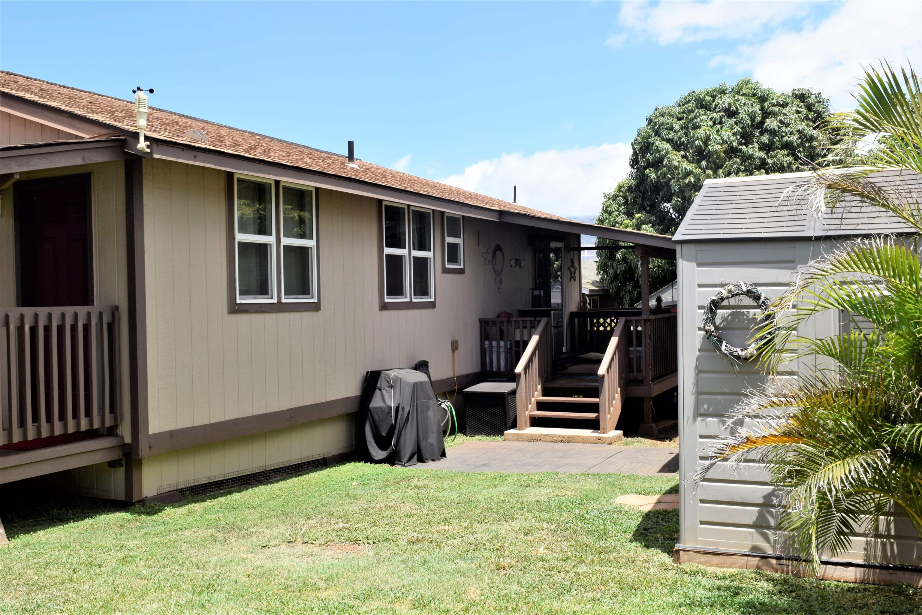 225 Humupea Street Kihei, HI 96753 - Photo 8 of 28 a view of a backyard with chairs and a slide