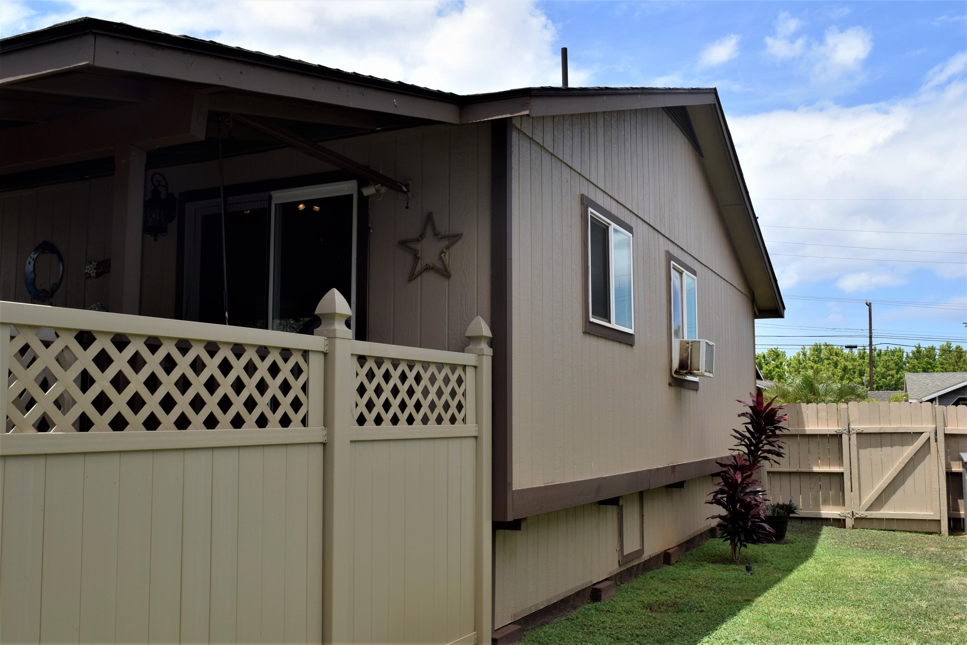 225 Humupea Street Kihei, HI 96753 - Photo 10 of 28 a front view of a house with a yard