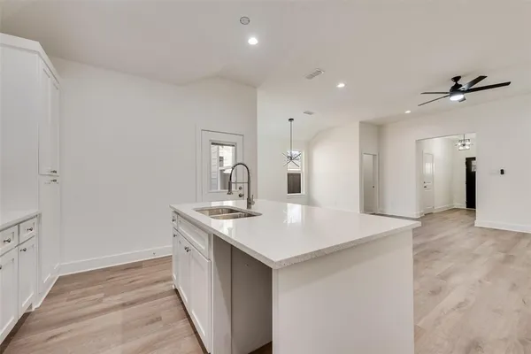 a kitchen with a sink and stove