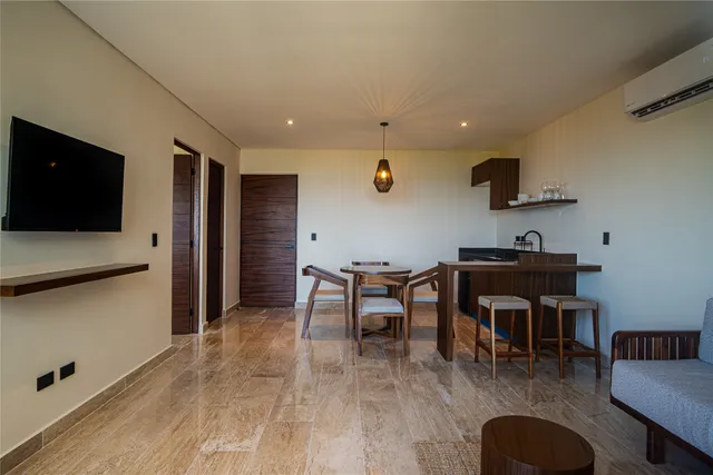 a living room with furniture and a lamp